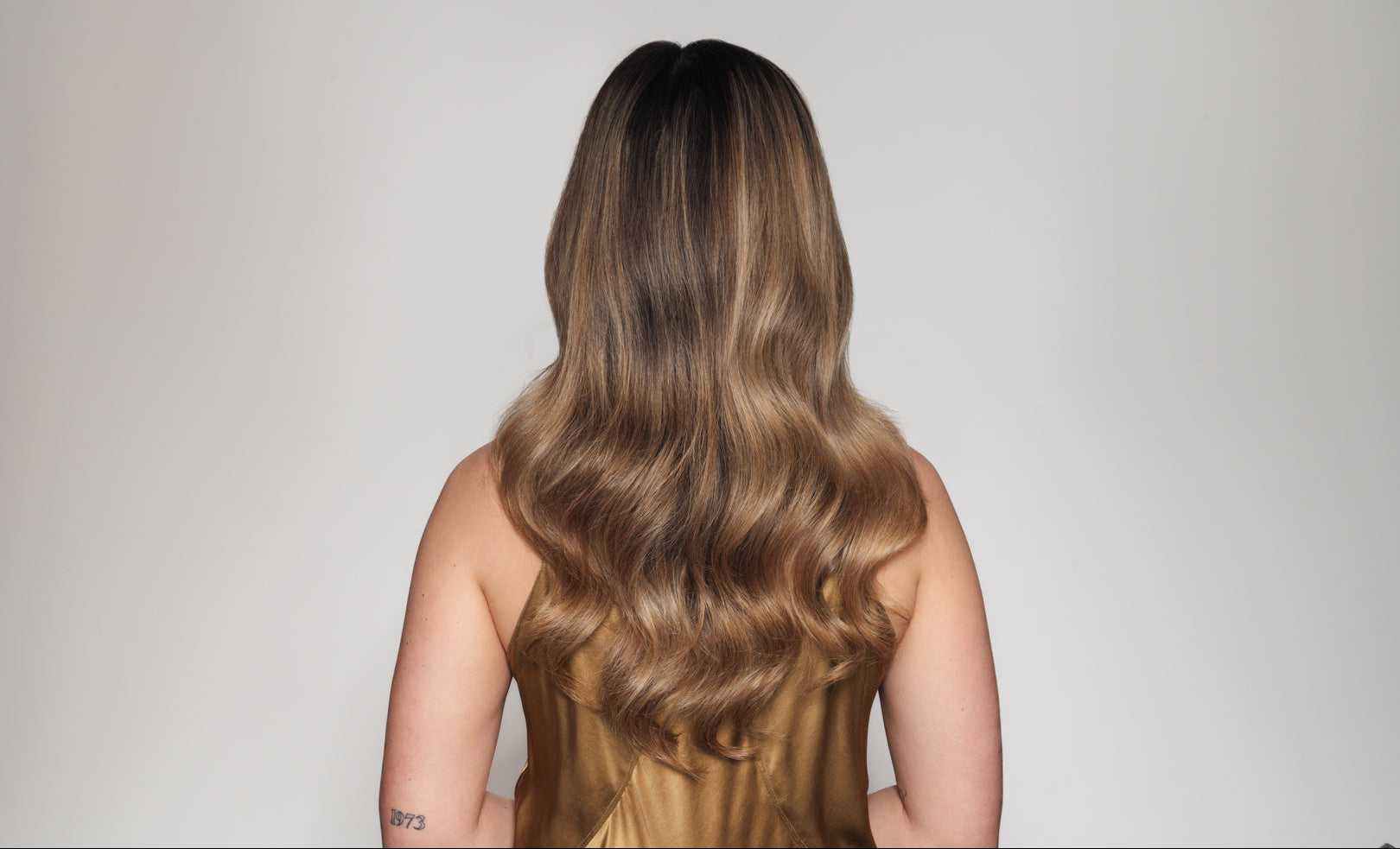 Hair shot from behind after split ends care treatment has been applied and damaged ends are restored