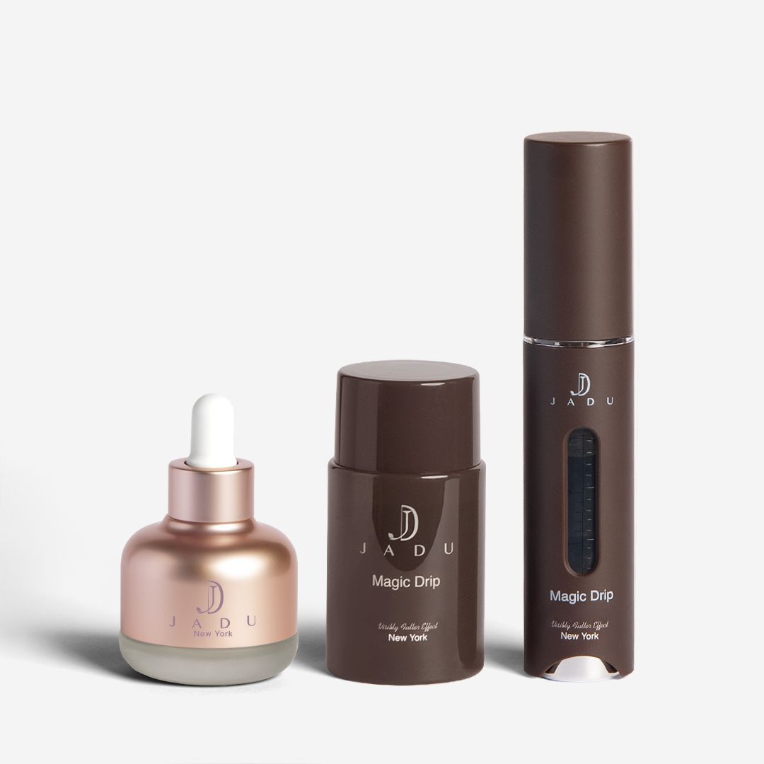 Jadu Split Ends Care oil next to the Magic Drip bottle and its applicator.