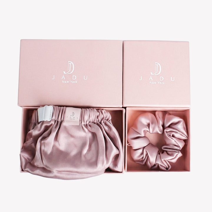Open gift box revealing Jadu silk bonnet and matching silk scrunchie | premium unboxing experience for a luxury silk hair gift