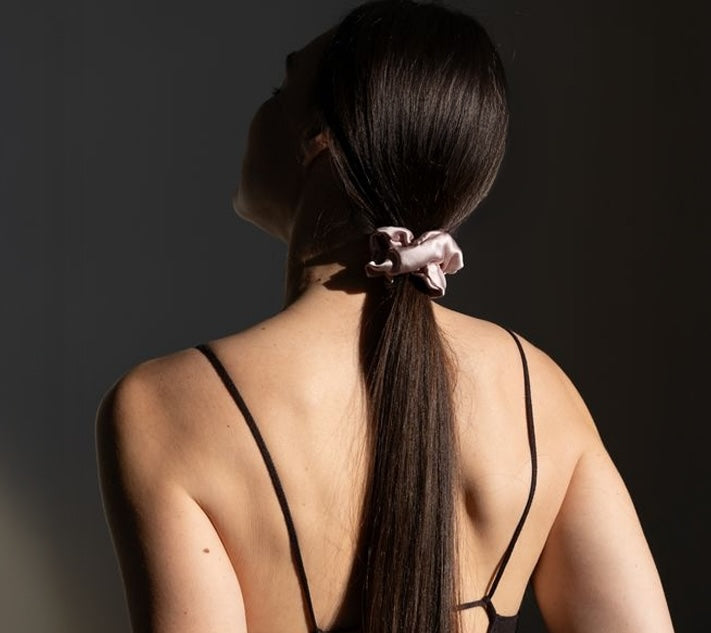 Jadu jumbo silk scrunchie in ponytail from behind helps reduce pulling from the roots