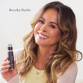 Brooke Burke holding magic drip which supports visibly thicker hair | start your hair care routine today