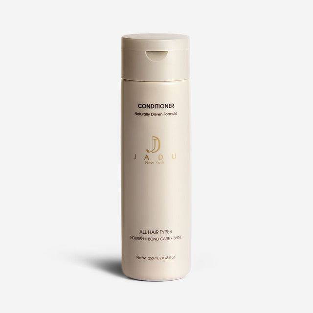 A 250 mL bottle of Jadu New York Conditioner that nourishes, cares for bonds and adds shine.