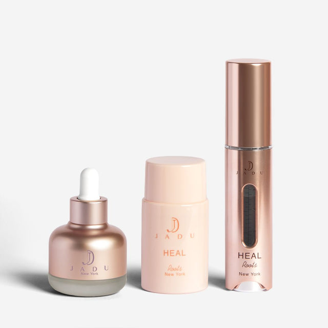 Jadu Split Ends Care oil next to the Heal Roots bottle and its applicator.