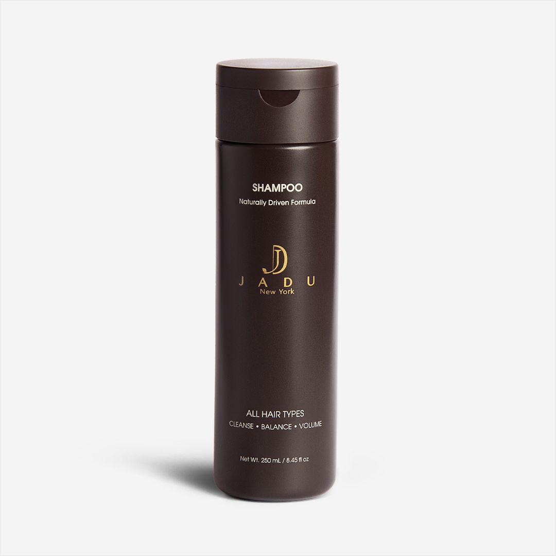 A 250 mL bottle of Jadu New York Shampoo, a naturally driven formula for all hair types.