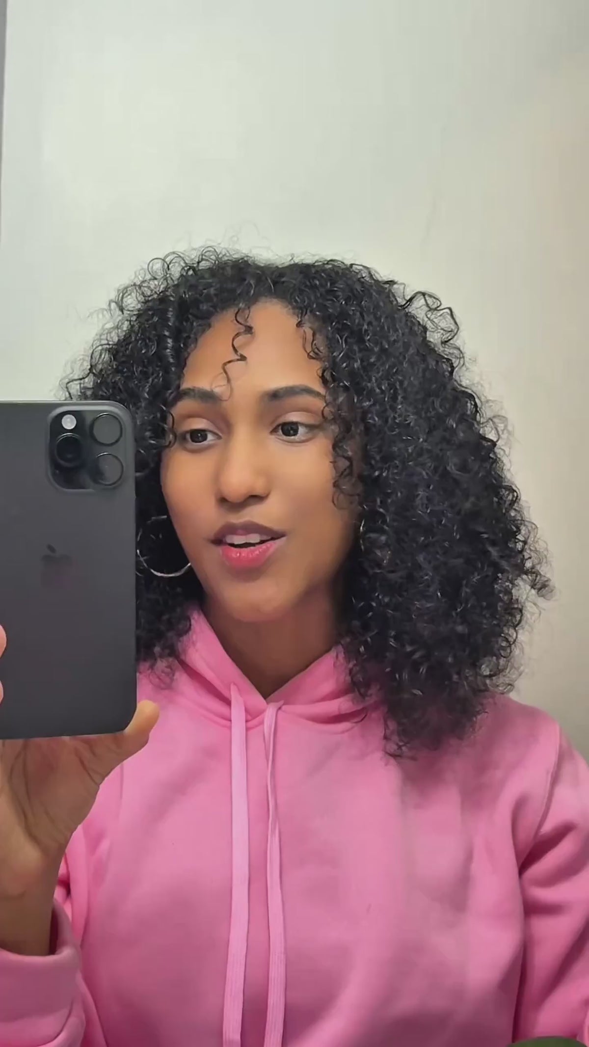 Customer in a pink hoodie